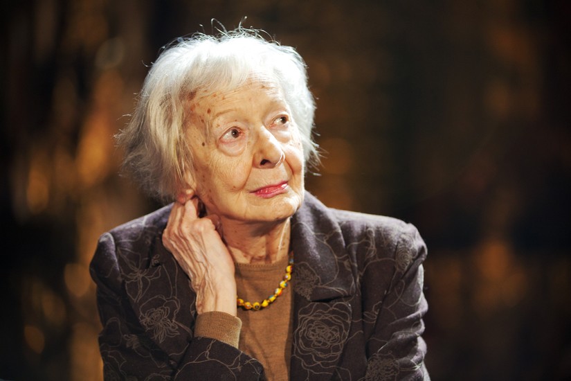 Polish poet wisława szymborska smiling in a hat on Craiyon