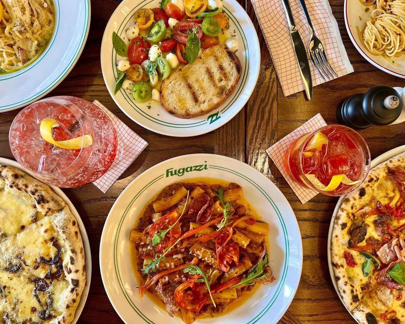 Fugazzi restaurant Rosebank, retro Italian diner, cozy seating, tomato pasta dish, penne alla vodka, fresh focaccia bread, authentic Italian pizza, Rosebank nightlife, casual dining Joburg, family-friendly restaurant, red sauce pasta, vintage decor, trendy Joburg eatery, Joburg ETC