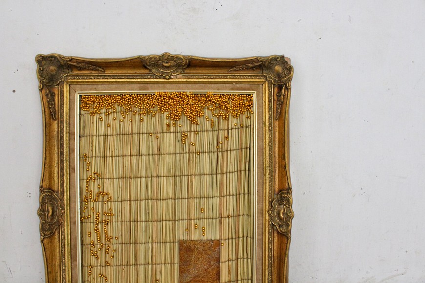 "Sifelani?" Straw mat, beadwork and oxidised metal in gilded frame. By Simphiwe Buthelezi. 