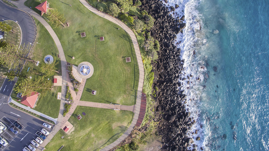 Bird's eye view of Danger Point and the Captain Cook Memorial Lighthouse in Coolangatta, Gold Coast