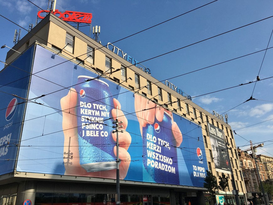 The Zenit building on Katowice's Rynek, covered with a massive Pepsi ad written in the Silesian dialect.
