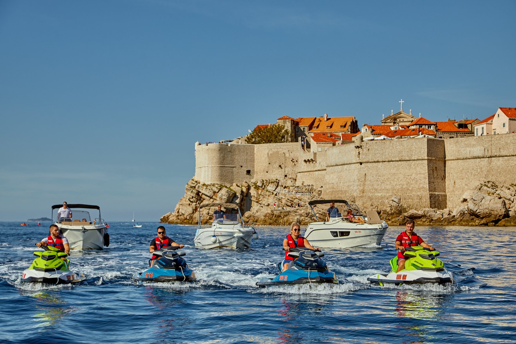 Group of Garitransfer jet ski and boat rental in Dubrovnik exploring Old Town coastline and Adriatic Sea