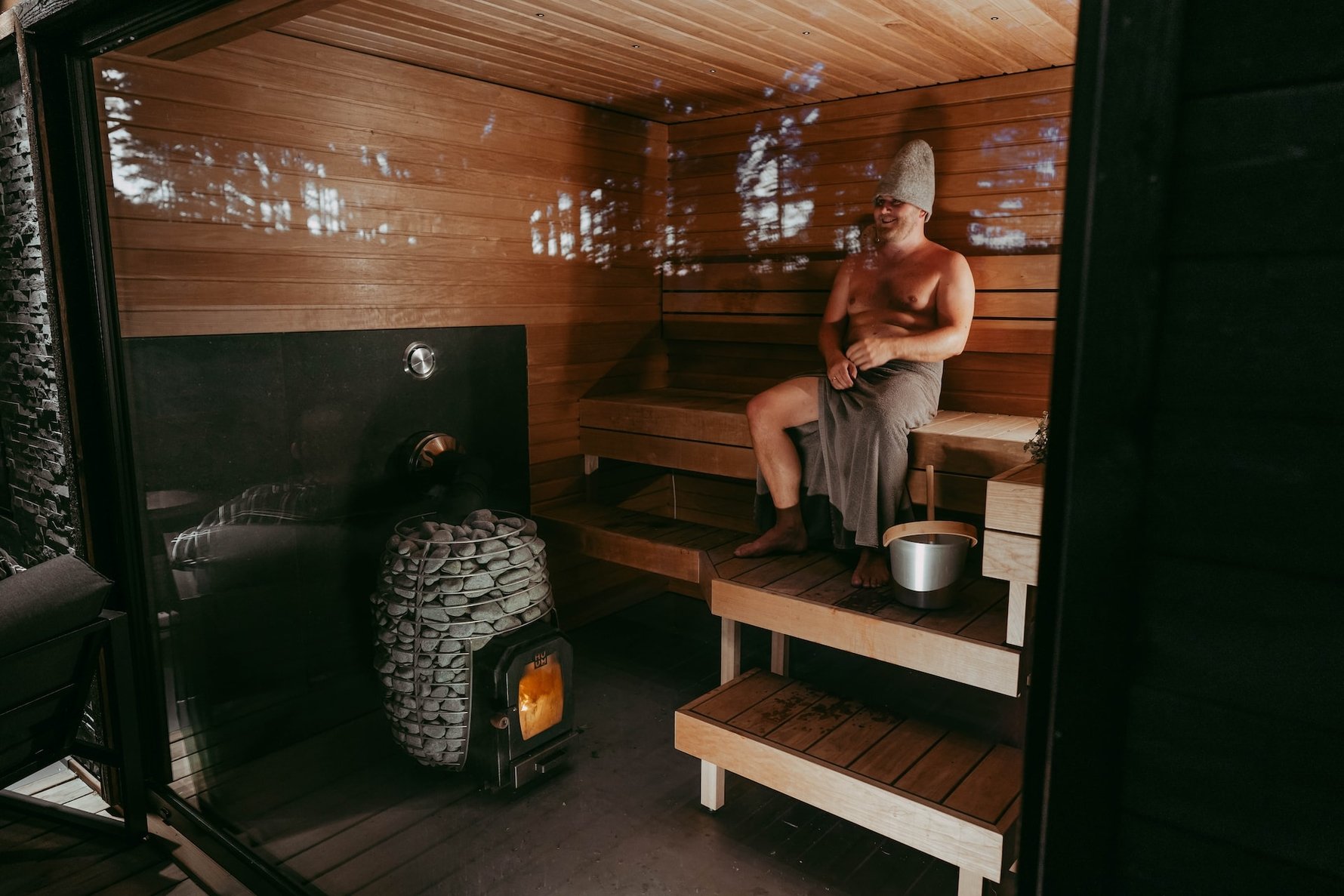 Finnish sauna with man inside © huum-unsplash