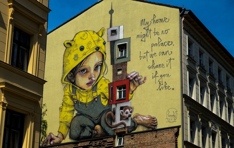 Large HERAKUT street art mural on a residential building in Berlin's Kreuzberg district, Berlin