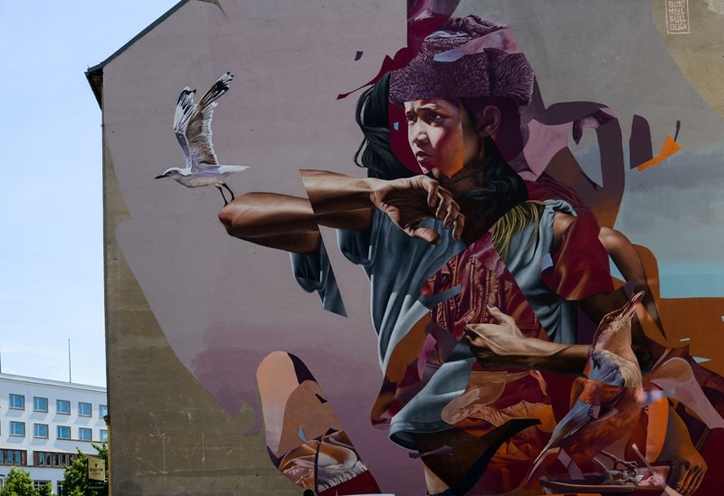 Large collaborative street-art mural painted on a Berlin building facade. Collaborative Mural by James Bullough, Telmo Miel and Others