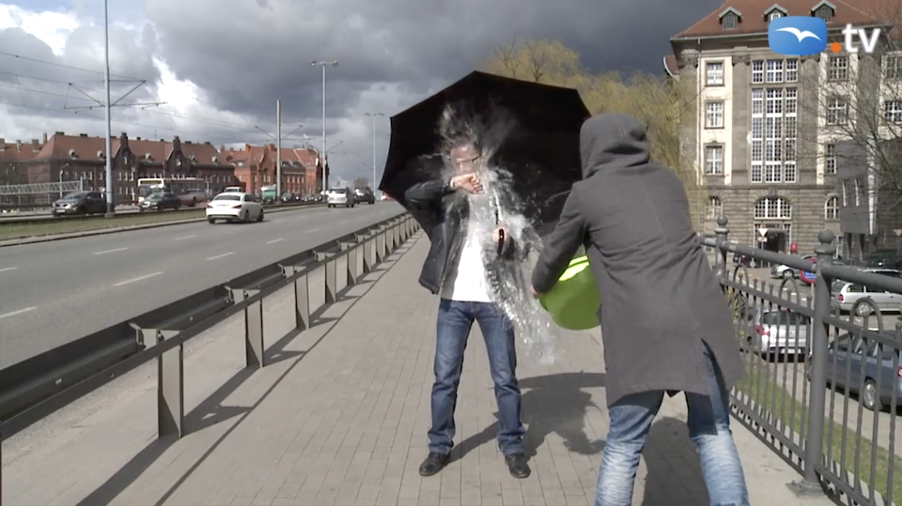 Trojmiasto TV Reporter Rafał Borowski being dunked with water in Gdańsk