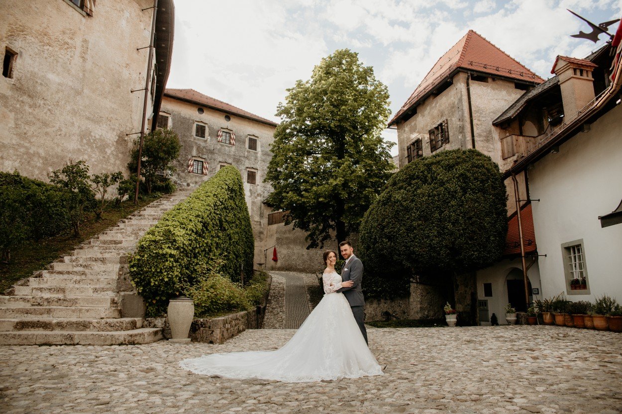 Bride and groom hugging at Castle bled