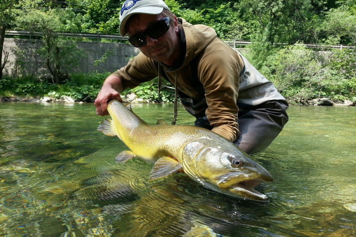 Fisherman with his catch / Slovenia Fishing Guides