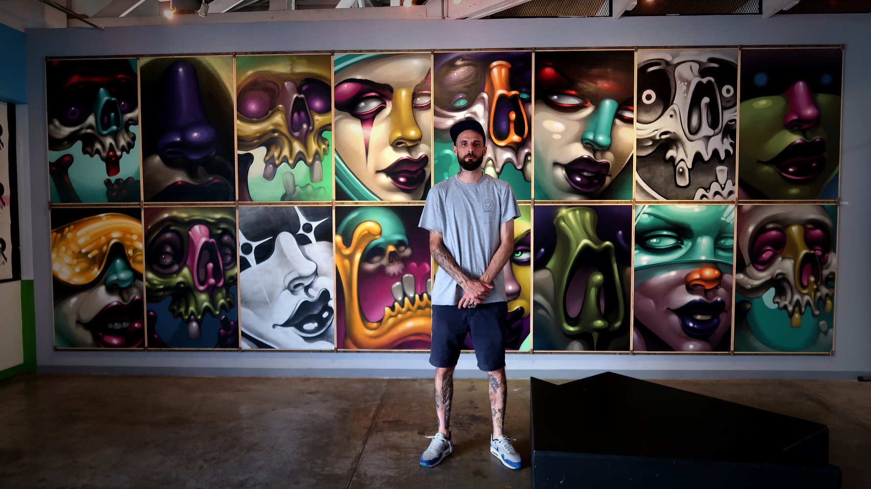 Rasty Knayles with his work at Grayscale Gallery.